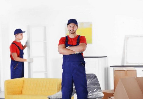 Van moving service team loading furniture safely in Sladegreen